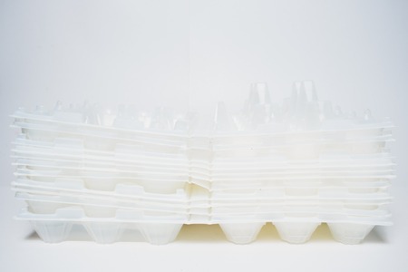 Plastic eggs box with clipping path isolated on white backgroundの写真素材