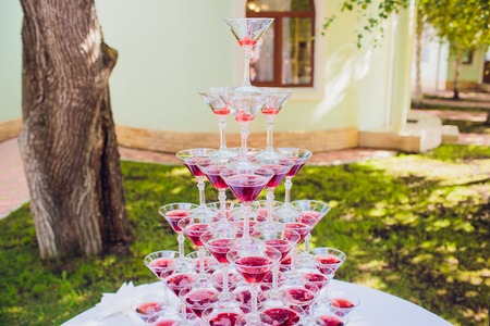 pyramid of glasses of wine, champagne on the streetの写真素材
