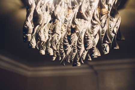 Contemporary chandelier made out of the light bulbsの写真素材
