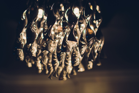Contemporary chandelier made out of the light bulbsの写真素材
