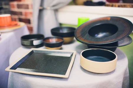 Stack of bowls in various shapes. Many colorful Sell at the market