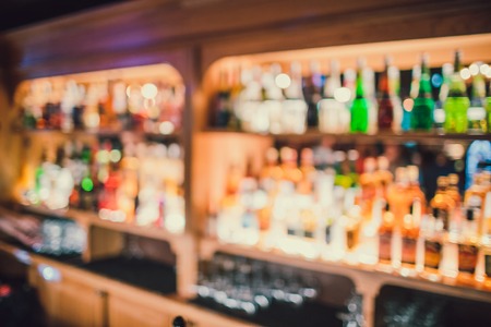 blurred background of bar and brown desk spaceの写真素材