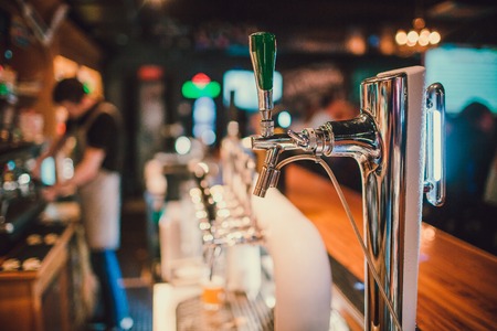 The system of bottling beer on the table of customers in the brewery