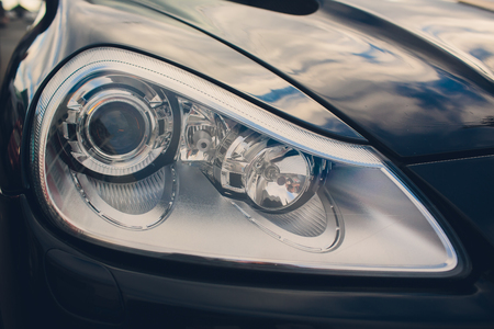 Closeup headlights of modern car. Concept of expensive, sports autoの写真素材