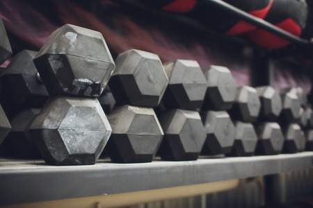 Gym and dumbbell weight training equipment on sport ,Healthy life and gym exercise equipments and sports concept ,copy spaceの写真素材