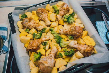 Potatoes with chicken baked in the oven. Delicious dish for dinnerの写真素材