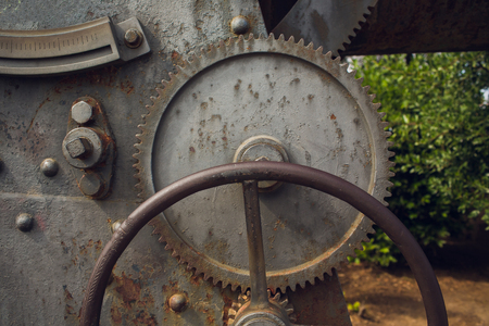Metallic Rusty industrial machine parts closeup photo.