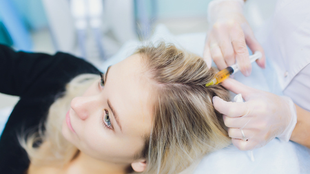 woman face injection. salon cosmetology procedure. skin medical care. dermatology treatment. anti aging wrinkle lifting.の写真素材