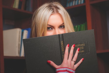 Reading and hiding behind a book