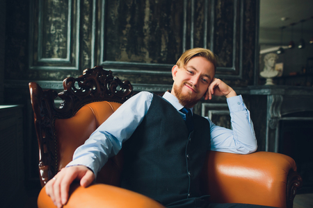 Portrait of blonde young man with uncommon appearance wears white t shirt.の写真素材