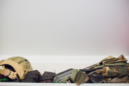 airsoft gun with the protective glasses and lot of bulletsの写真素材