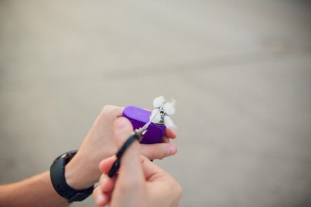 Rebuildable dripping atomizer or RDA for vaping or e-cigarette with Alien Clapton coil and cotton stripes wetted with e-liquid, modern vape device for quit smoking, macro photo with selective focus.の写真素材