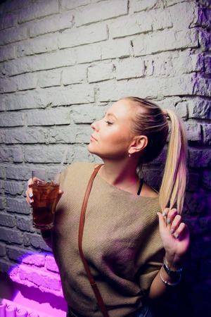 party concept - beautiful woman in evening dress with cocktail.の写真素材