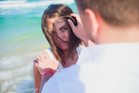 couple in white clothes on background sea oceanの写真素材