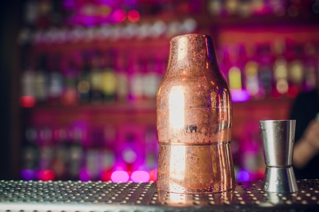dispenser and shaker on the background of bar