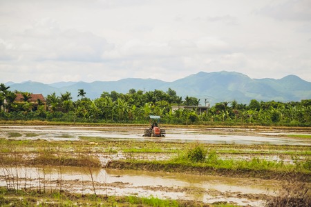 Soil preparation for farming With a tractor to adjust the soil.の写真素材