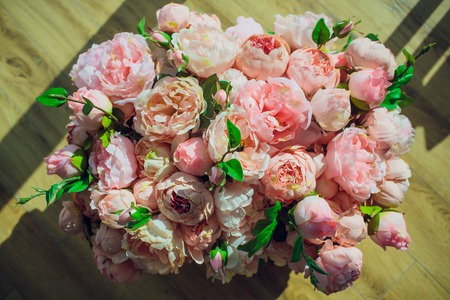 Roses in the box on wooden background