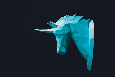 Unicorn turquoise head paper isolated on black background. Copy space.の写真素材