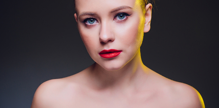 beautiful blond woman portrait on black background.の写真素材