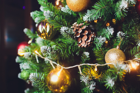 Christmas background - baubles and branch of spruce tree.の写真素材