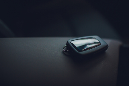 Passing car keys. Cropped closeup car dealer holding out car keys camera copyspace car dealership salon manager salesman selling buying giving owner profession purchase vehicle conceptの写真素材