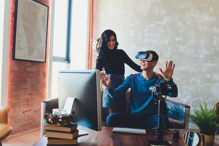 People shooting on special camera wearing vr headset. video producer, creation of virtual content, computer, glasses.の写真素材