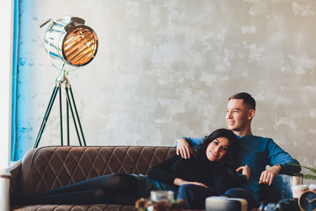 Love story of a lovely couple in loft interior.の写真素材