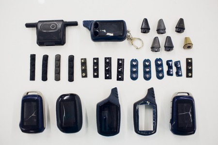Close-up of a damaged car key isolated on white background.