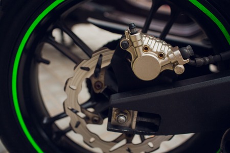 Disc brake of eco motorcycle, , scooter motorcycle background
