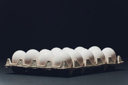 Several white eggs in an egg cartonの写真素材
