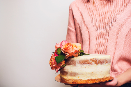 Young woman girl with cake isolated on whiteの写真素材