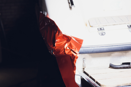 Car wrapping specialist putting vinyl foil or film on car. Selective focus.の写真素材