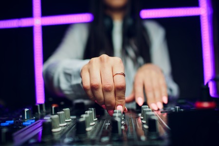 man DJ playing music club at mixer closeupの写真素材