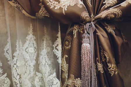 Holder for room curtains. Fragment photo curtain, interior detail, curtain detail close upの写真素材