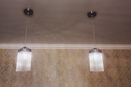 Beautiful chandelier. Modern chandelier hanging under ceiling