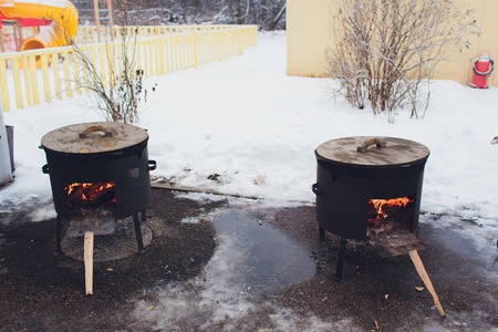 flame of fire. picnic. food on the street. pot on the fire. cooking food on fire.fire on the coals....