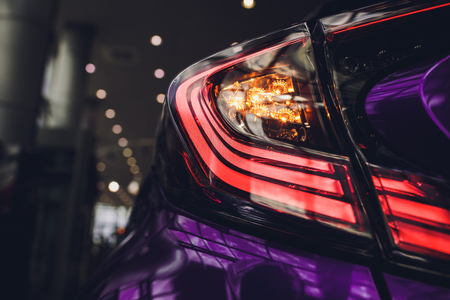 Detail on the rear light of a purple carの写真素材