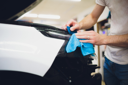 Transparent film, car paint protection, wrapping specialis. Car detailingの写真素材