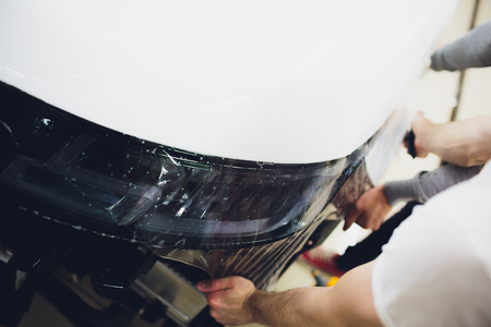 Transparent film, car paint protection, wrapping specialis. Car detailingの写真素材