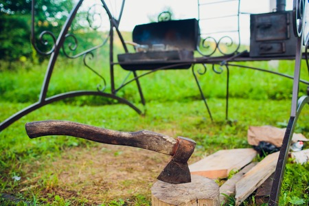 ax against a background of fire, knives, fires ragedの写真素材