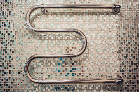 towel and robe on the rack in the bathroomの写真素材
