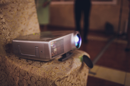 Closeup of projector for presentation in blue light toneの写真素材