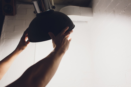 Hands changing with new LED lamp light bulb,Power saving conceptの写真素材