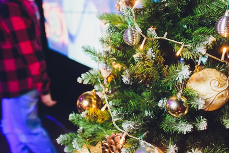 gold and silver Christmas decorations on the treeの写真素材