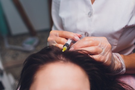 Platelet rich plasma injection procedure. Hair growth stimulation. PRP therapy processの写真素材