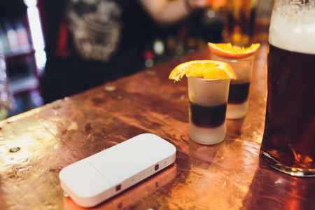 Photo product IQOS 2.4 plus heat control technology electronic cigarette and FIIT change up on wood background.の写真素材