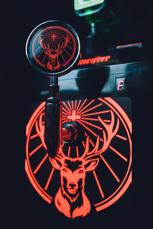 Ufa, Russia, HARATS PUB, 12 December, 2018: Jagermeister alcohol drinks in bar. bartender pours a...