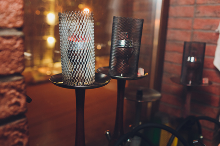 Trendy hookah with cloud of smoke bar.