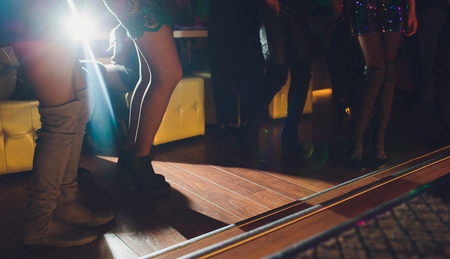 Legs of dancing people at the partyの写真素材