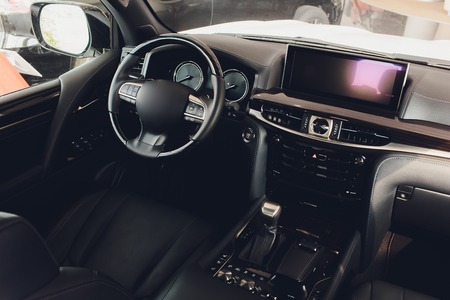 car interior. Modern car speedometer and illuminated dashboard. Luxurious car instrument cluster. Close up shot of car instrument panelの写真素材